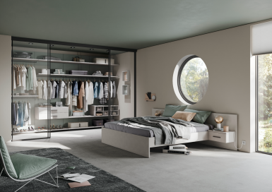 Raumplus Gleittüren - Modernes Schlafzimmer mit offener Schranklösung und eleganten Glas-Gleittüren von raumplus.